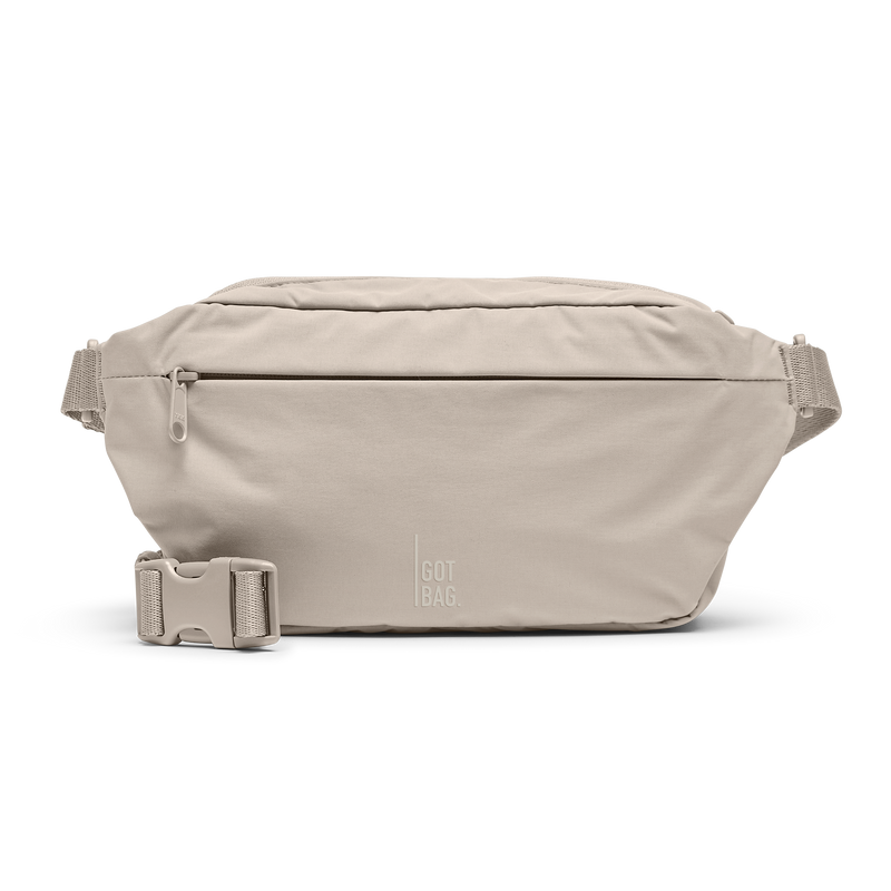 ADAPT SLING BAG bag in scallop (Light Beige), studio shot, front view.