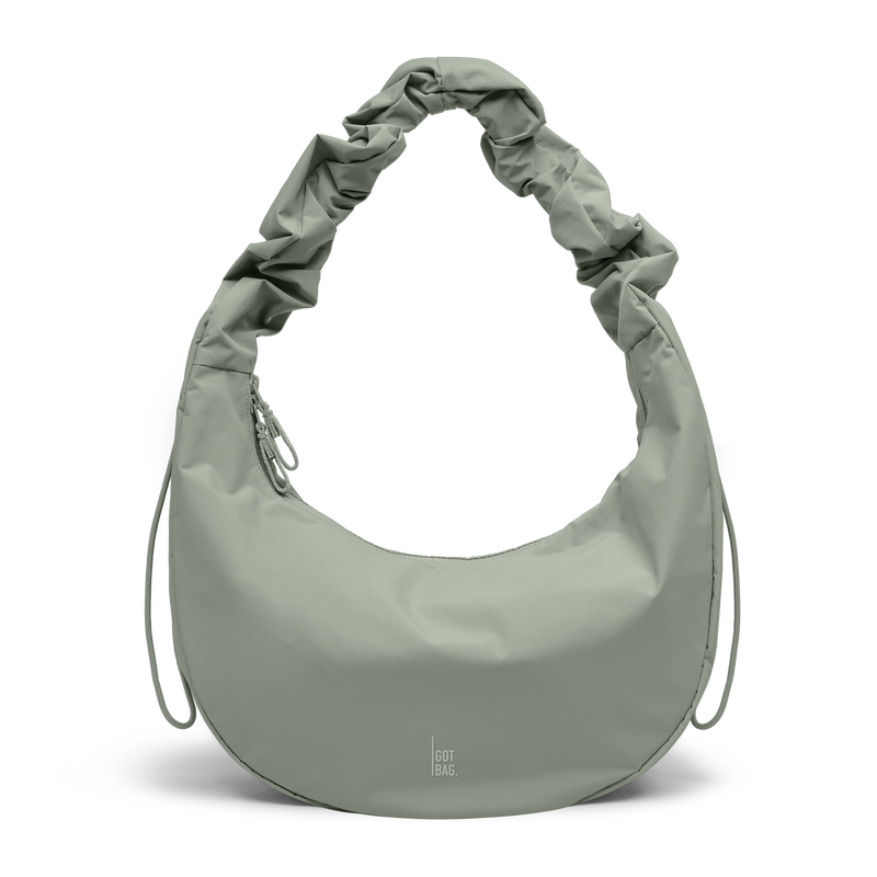 MOON BAG RUFFLE bag in bass (Sage Green), studio shot, front view.