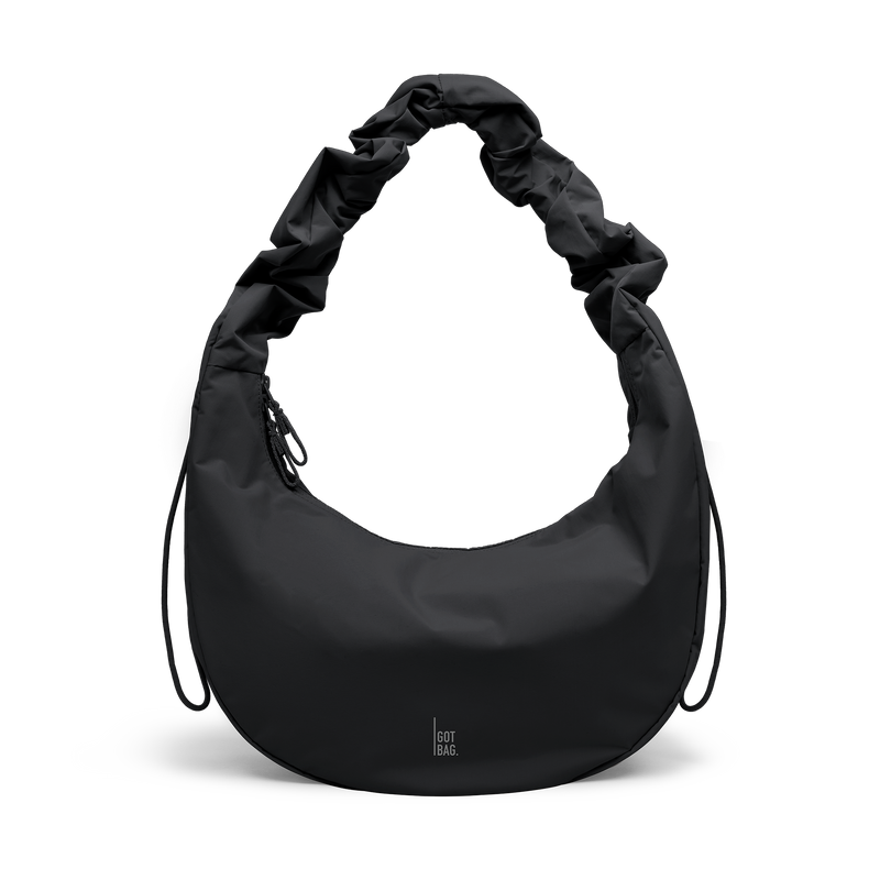 MOON BAG RUFFLE bag in black (Black), studio shot, front view.