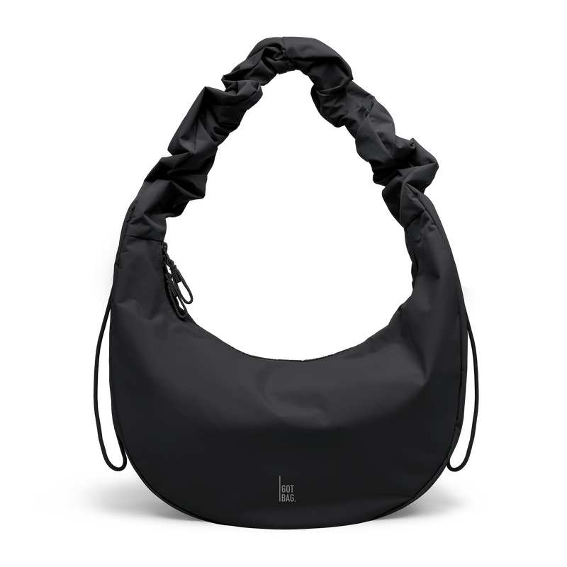 MOON BAG RUFFLE bag in black (Black), studio shot, front view.