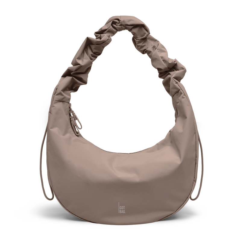 MOON BAG RUFFLE bag in oyster (Classic Taupe Brown), studio shot, front view.