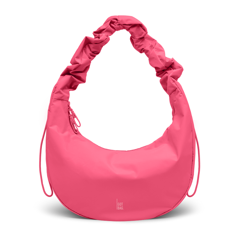 MOON BAG RUFFLE bag in salina pink (Vibrant Pink), studio shot, front view.