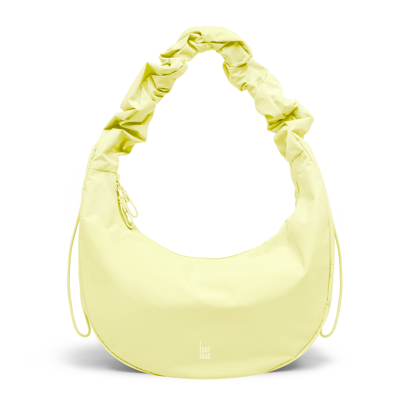 MOON BAG RUFFLE bag in sea lemon (Soft Pastel Yellow), studio shot, front view.