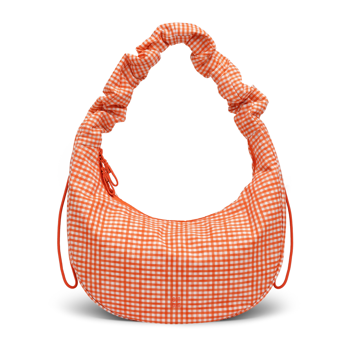MOON BAG RUFFLE bag in vichy hot coral (Orange-Beige Checkered), studio shot, front view.