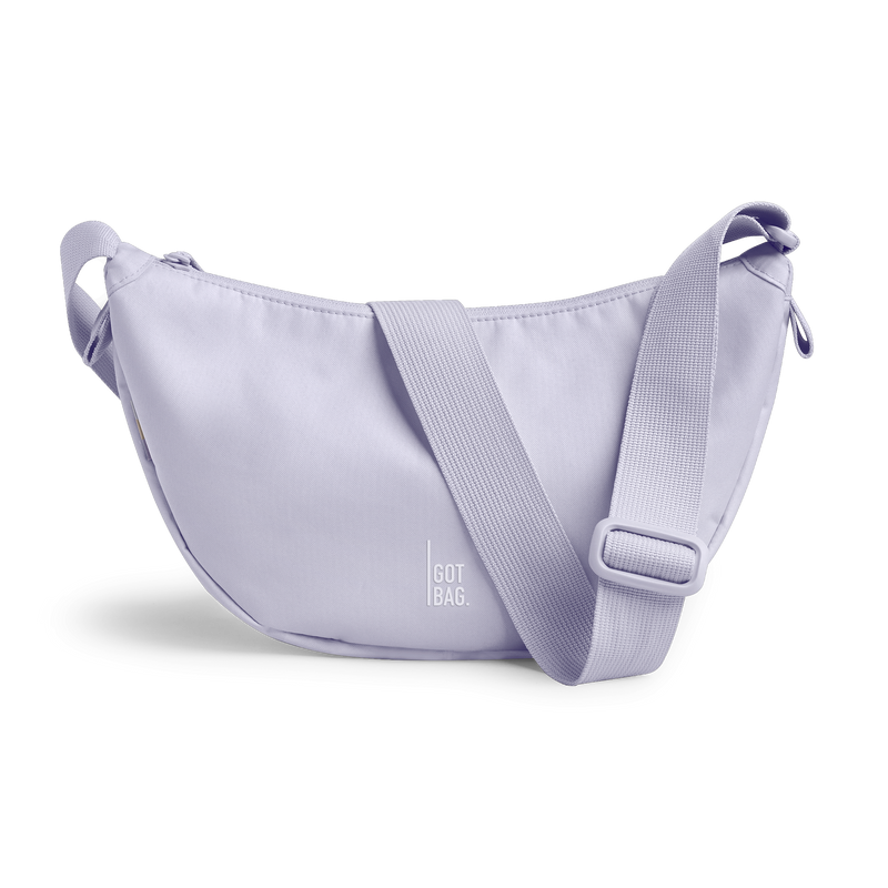 MOON BAG SMALL bag in purple coral (Pastel Light Lilac), studio shot, front view.