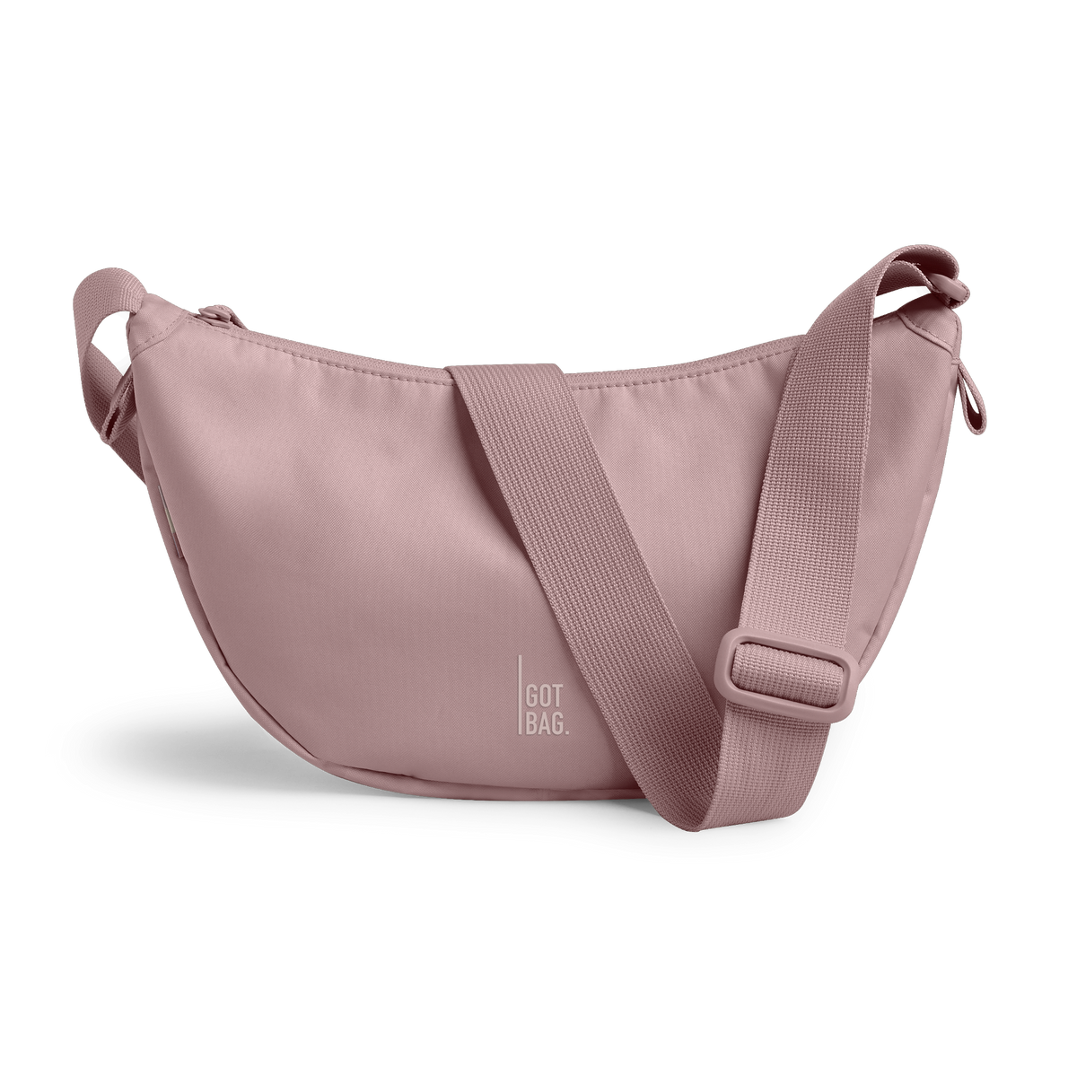 MOON BAG SMALL bag in red sand (Pastel Light Pink), studio shot, front view.