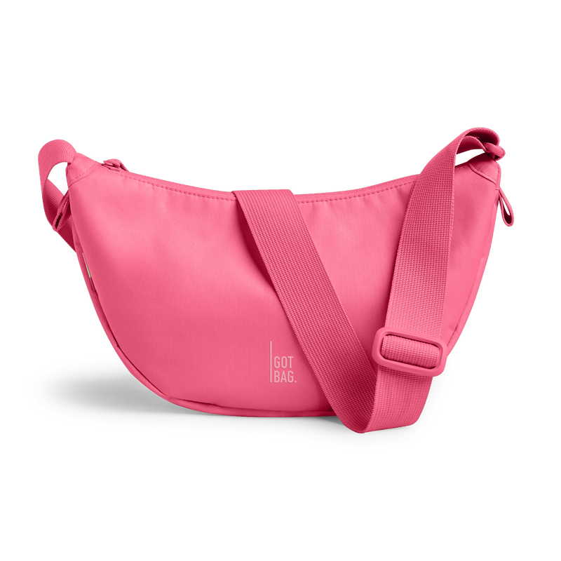 MOON BAG SMALL bag in salina pink (Vibrant Pink), studio shot, front view.