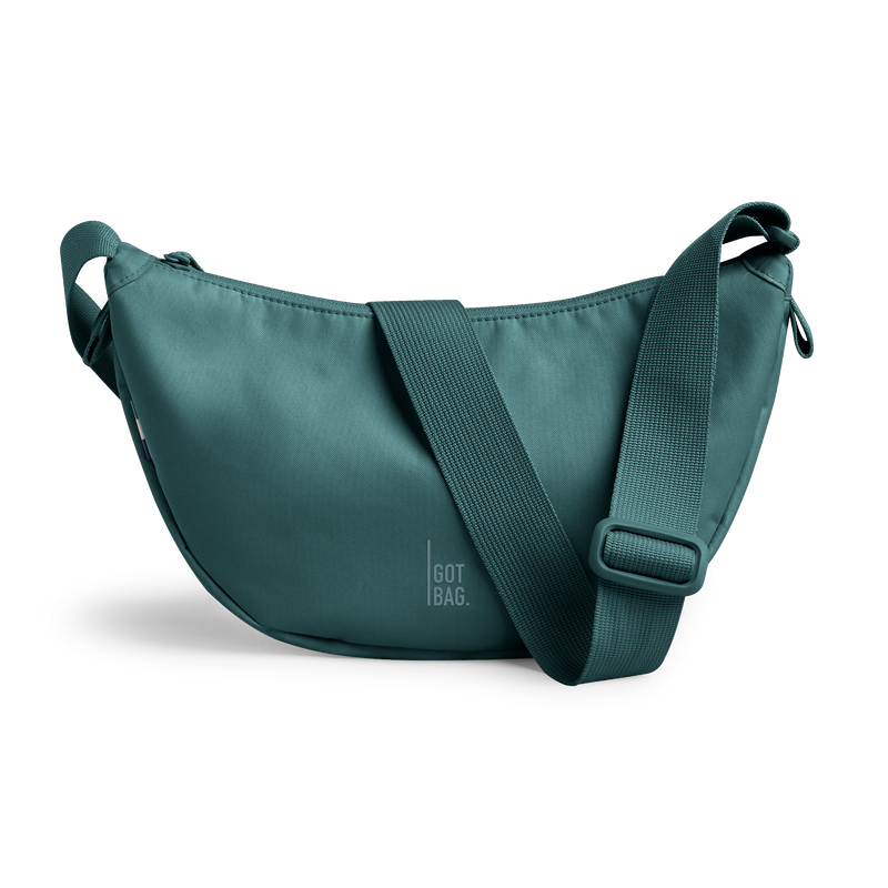 MOON BAG bag in sea teal (Cool Turquoise Green), studio shot, front view.