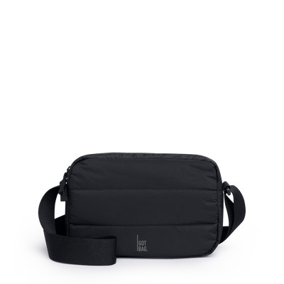PUFFER CROSSBODY BAG bag in black (Black), studio shot, front view.