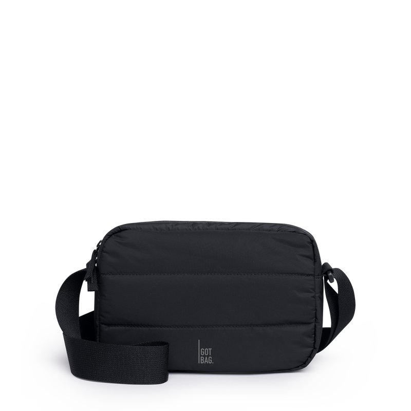 PUFFER CROSSBODY BAG bag in black (Black), studio shot, front view.