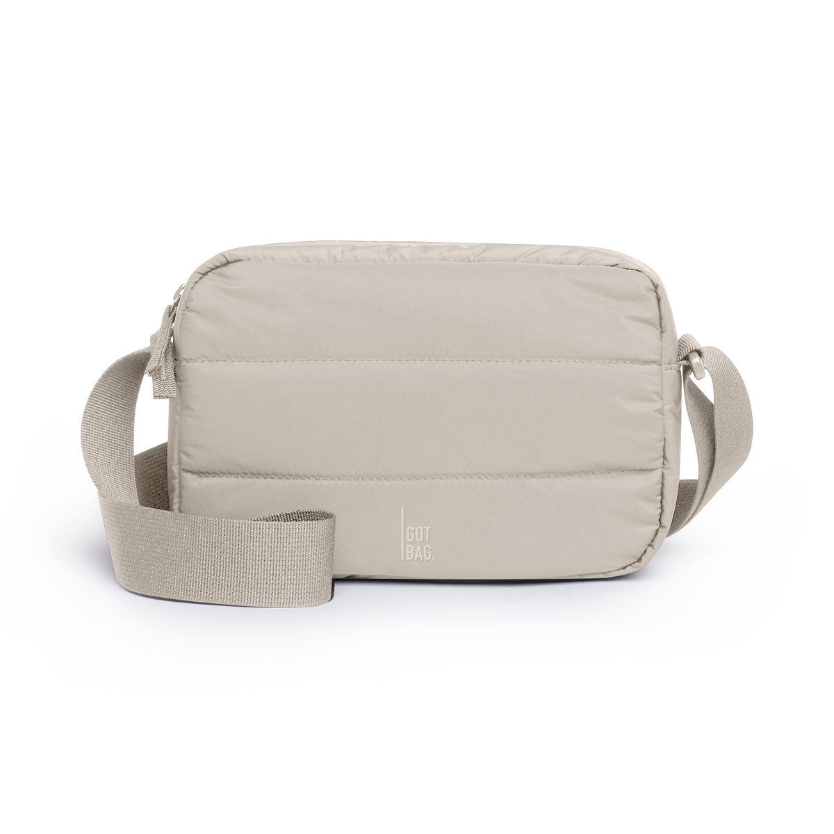 PUFFER CROSSBODY BAG bag in scallop (Light Beige), studio shot, front view.