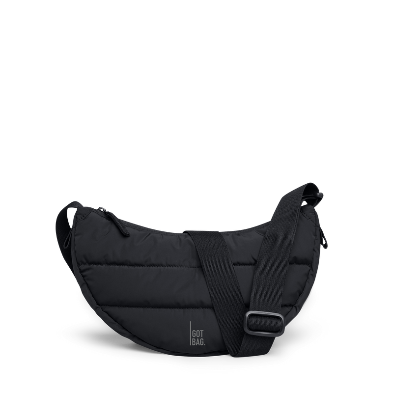 PUFFER MOON BAG SMALL bag in black (Black), studio shot, front view.