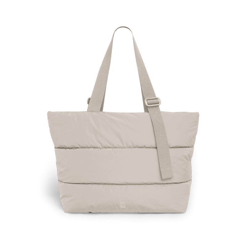 PUFFER TOTE BAG bag in scallop (Light Beige), studio shot, front view.