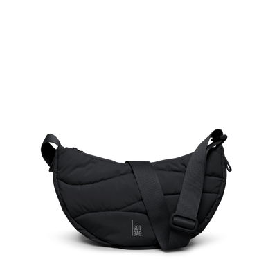 WAVY PUFFER MOON BAG bag in black (Black), studio shot, front view.